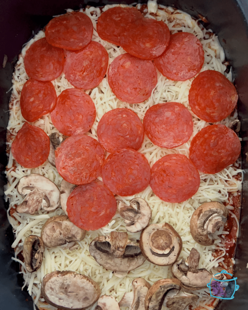 all crustless pizza ingredients in slow cooker ready to go