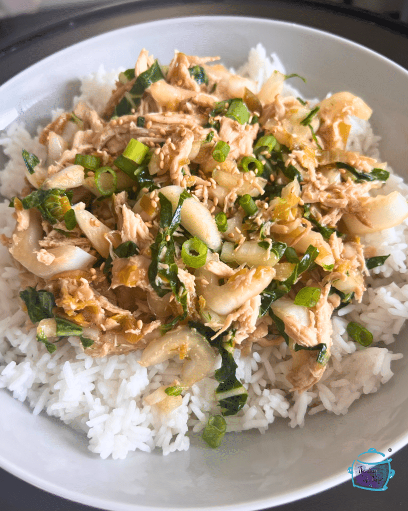 slow cooker chicken and bok choy with leaks on a bed of rice