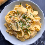 Slow cooker rosemary ranch chicken and noodles in a bowl.