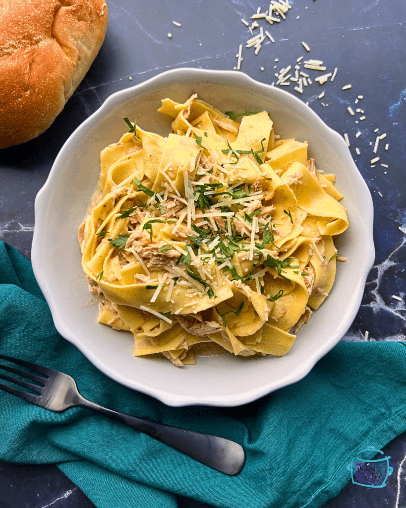 Slow cooker rosemary ranch chicken and noodles in a bowl.
