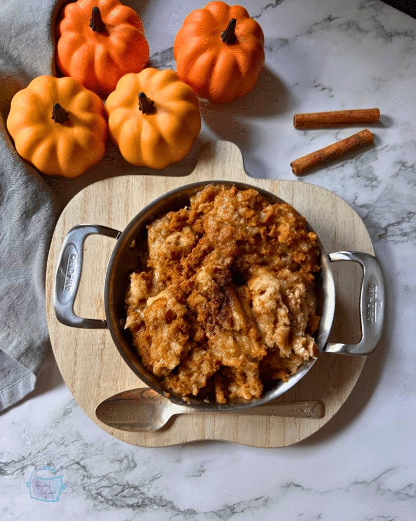 slow cooker pumpkin cobbler in a round pot with handles