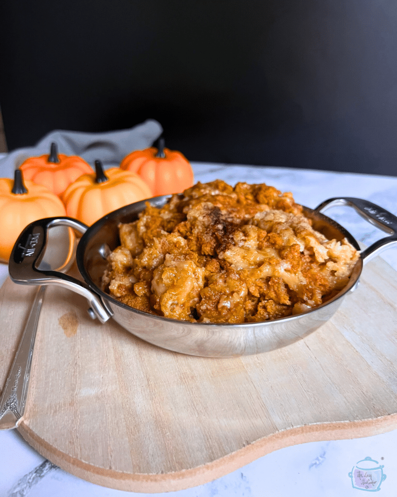 slow cooker pumpkin cobbler in a round pot with handles