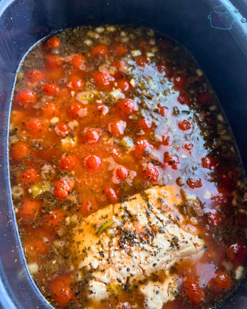 tomato and feta soup ingredients in a crockpot after cooking