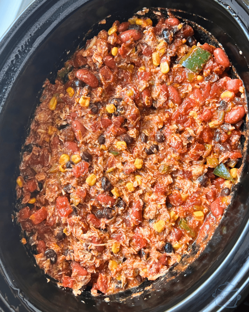 slow cooker insert filled with cooked leftover turkey chili