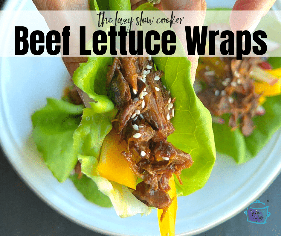 slow cooker beef lettuce wrap being held in a hand