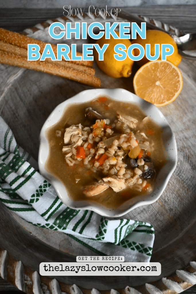 a white bowl filled with soup, mushrooms, veggies and barley