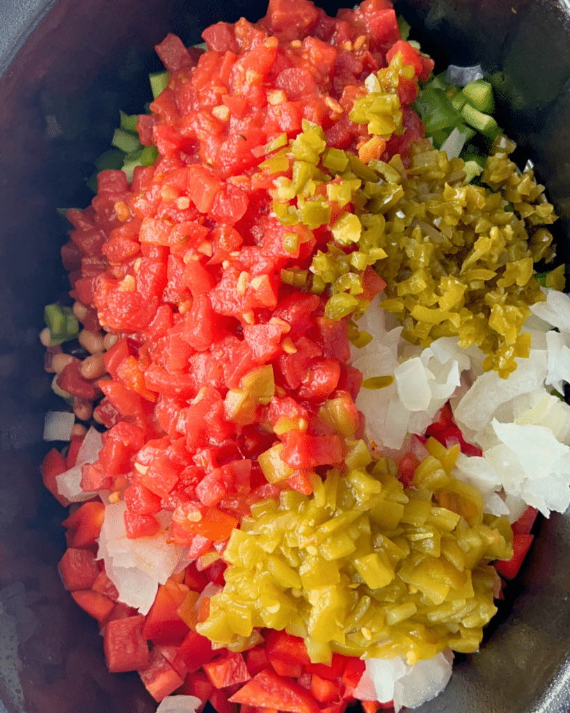 cowboy caviar in a slow cooker before liquid is added.