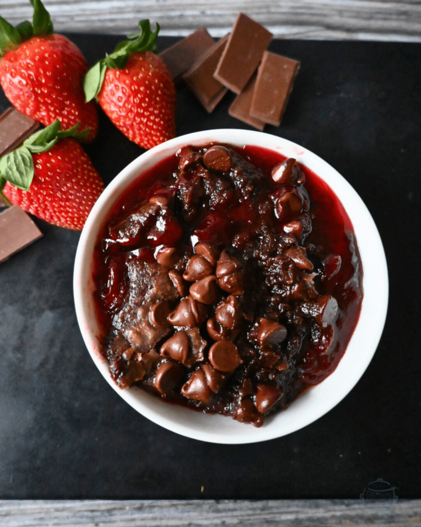 a bowl full of slow cooker chocolate strawberry spoon brownie