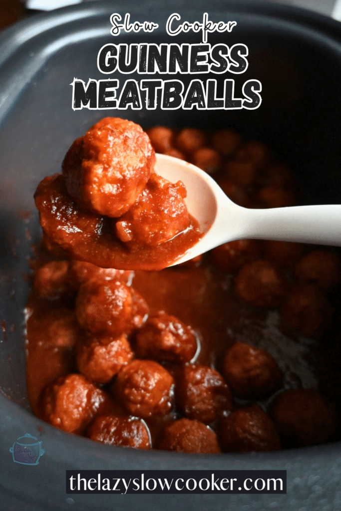 glazed meatballs on a spoon held over a slow ooker