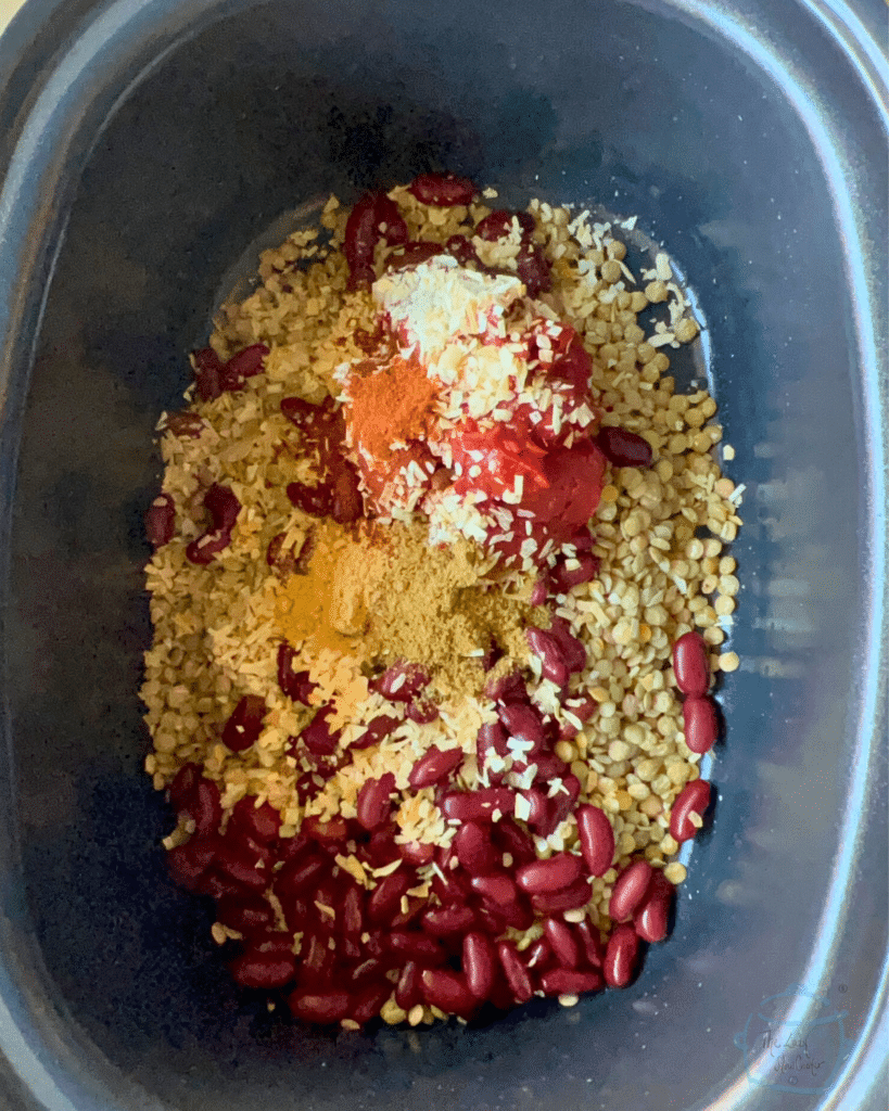 madras lentil ingredients in a slow cooker