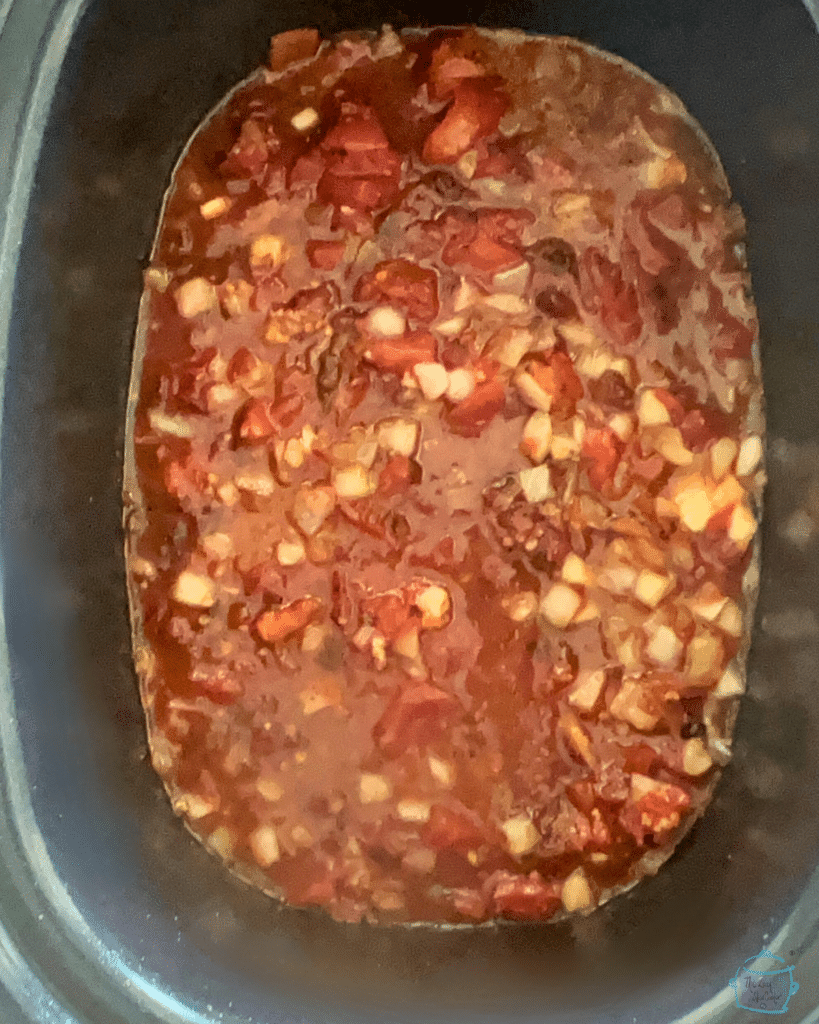 Shredded chipotle beef seasoning in a crockpot