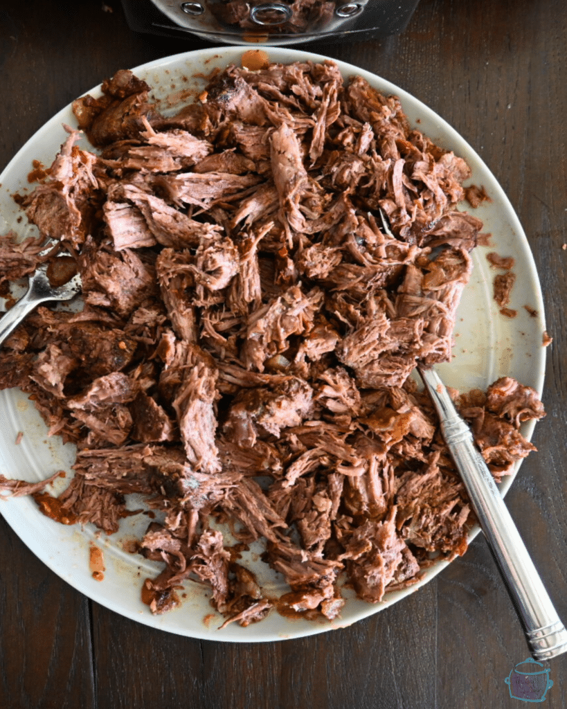 shredded cooked chuck roast on a plate