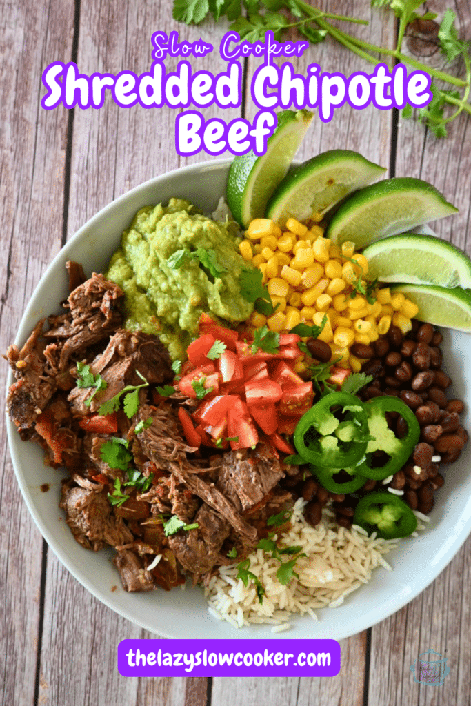 a plate of chipotle beef with corn beans tomatoes and lime wedges