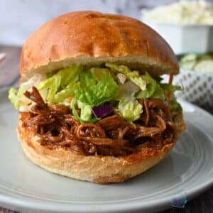 bbq brisket sandwich on a brioche bun with lettuce