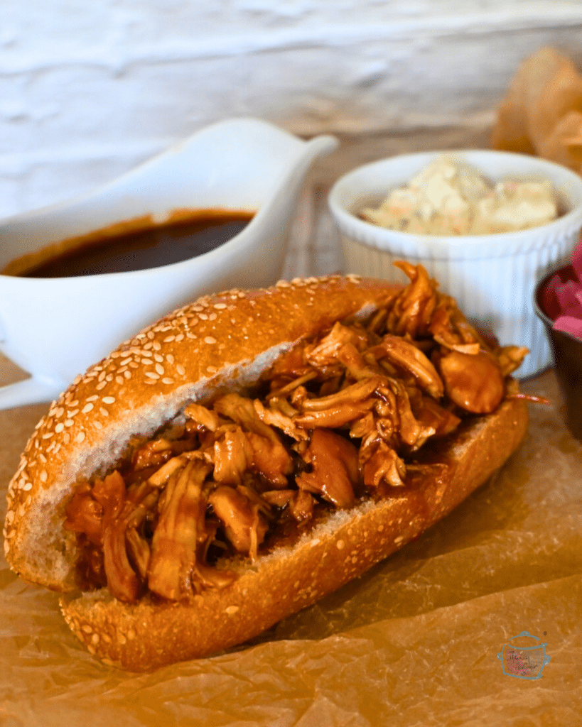 A sesame hoagie roll filled with bbq turkey tenderloin