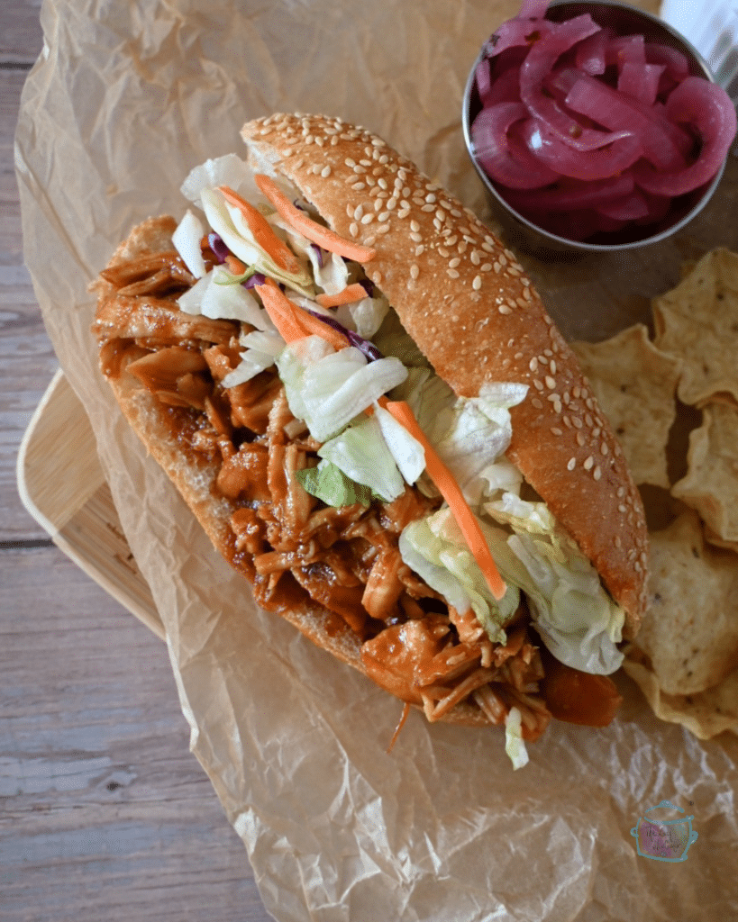 A sesame hoagie roll filled with bbq turkey tenderloin