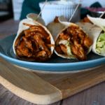 three wraps filled with bbq'd slow cooker turkey tenderloin.