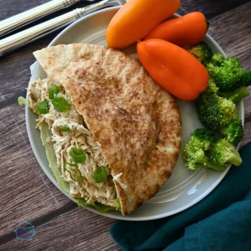 Lemon Tahini slow cooker chicken in a pita pocket
