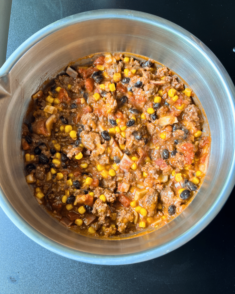 tortilla lasagna filling mixture in a silver bowl