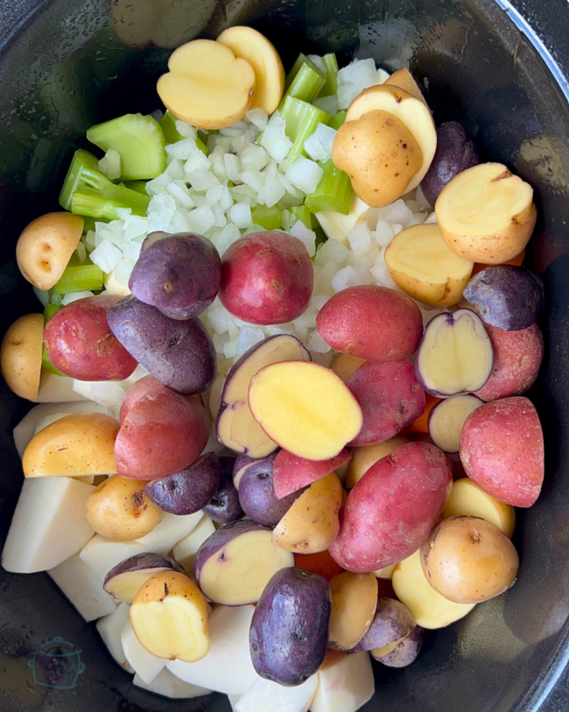 potatoes and vegetables in a slow cooker