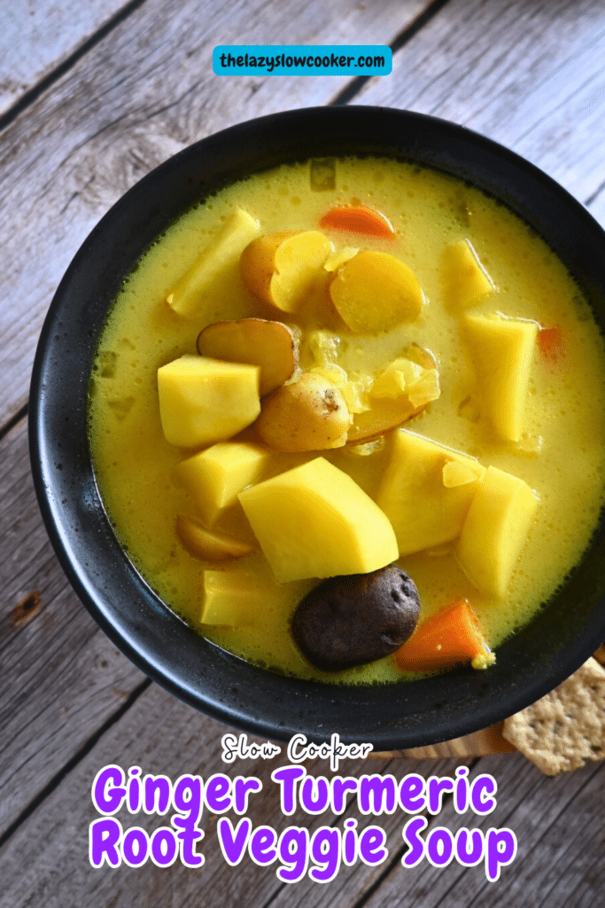 a bowl of ginger turmeric root vegetable soup with some crackers