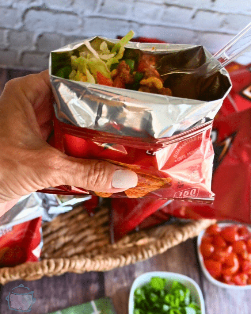 a walking taco held over a tray of the same