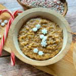 a bowl of eggnog oats topped with candy slow flakes