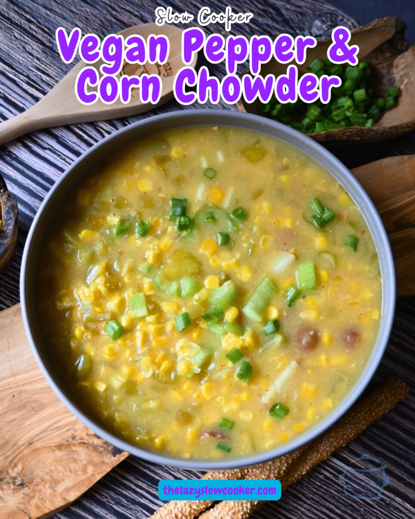 pepper and corn chowder in a round gray bowl with a wooden spoon.