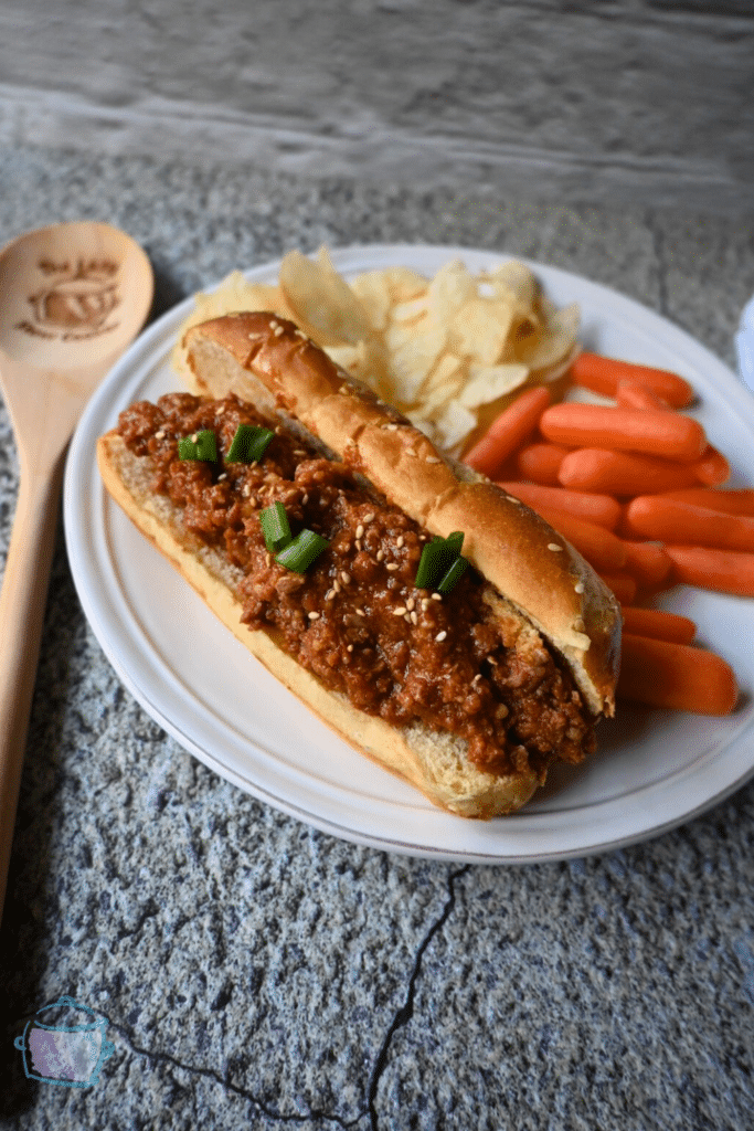 slow cooker honey garlic sloppy Joe on a pretzel bun