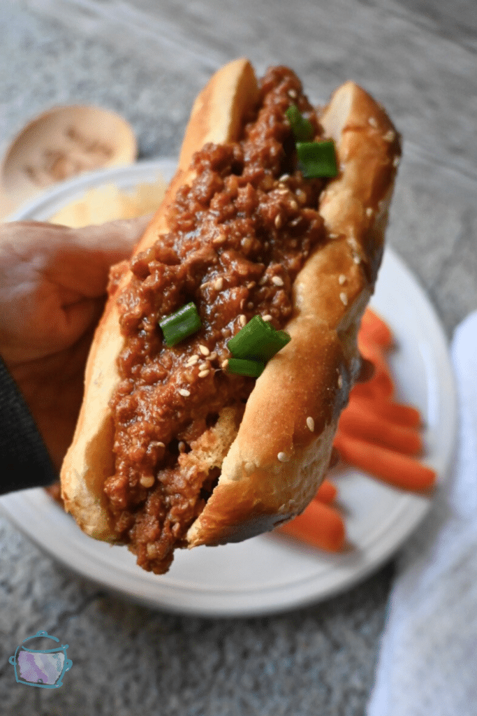 slow cooker honey garlic sloppy Joe on a pretzel bun