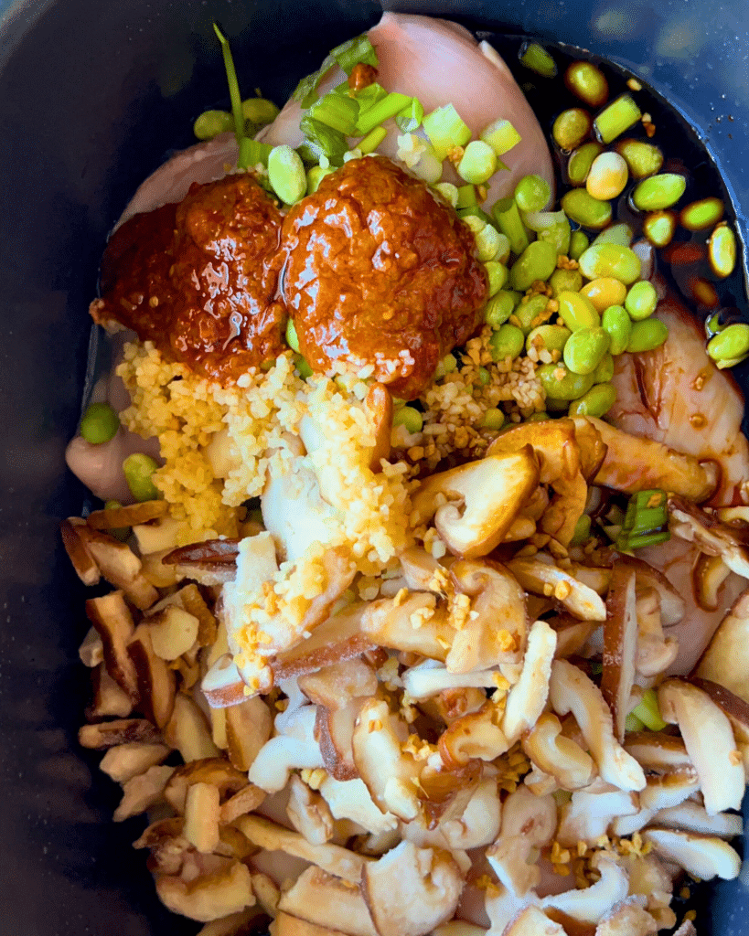 coconut curry ramen ingredients in a slow cooker