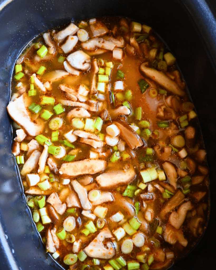 coconut curry chicken ingredients in slow cooker before cooking