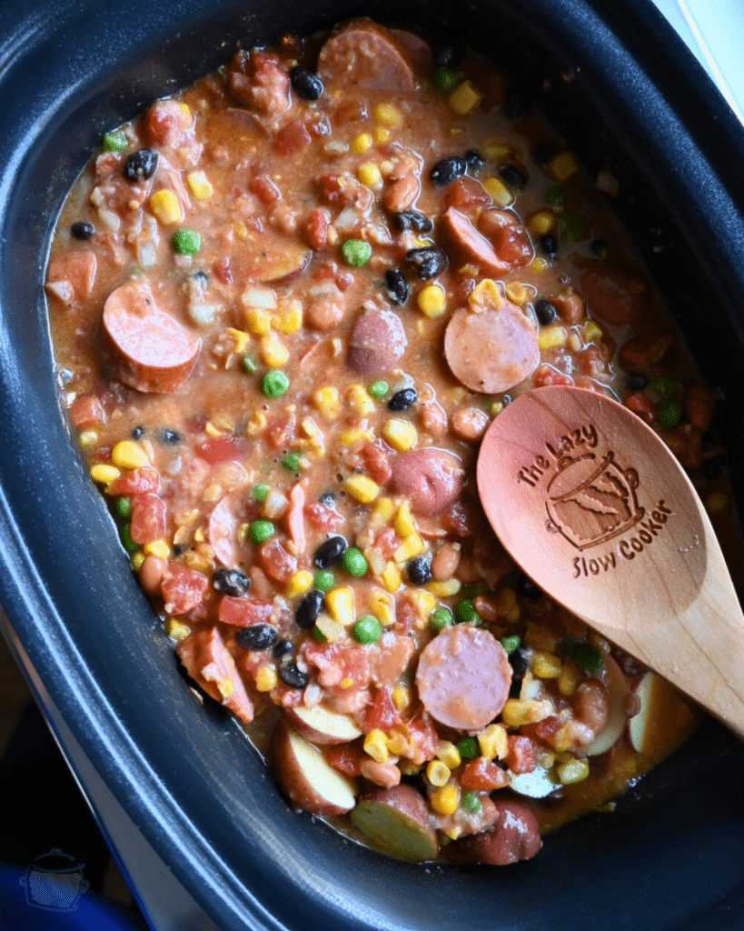all Texas stew ingredients mixed together in a slow cooker before cooking.