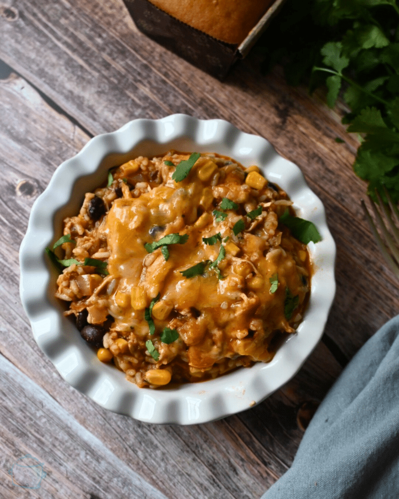 slow cooker southwest chicken in a round white bowl