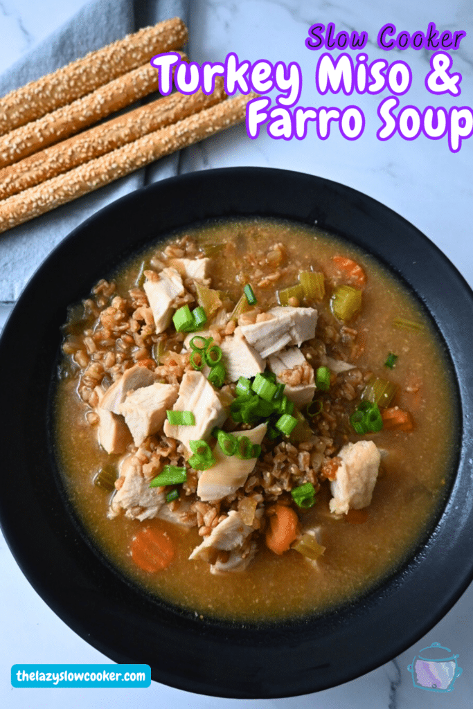 a black bowl filled with turkey farro miso soup