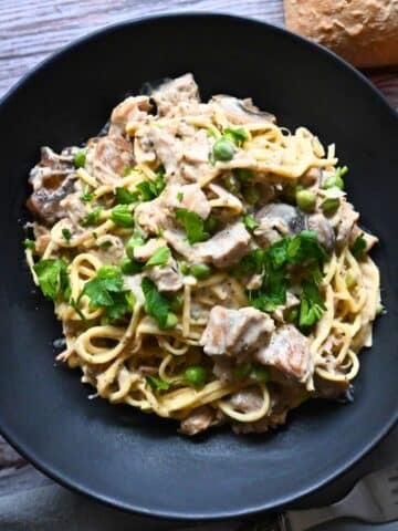 crockpot leftover turkey tetrazzini in a black bowl