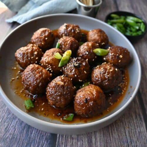 a bowl full of slow cooker spicy maple meatballs ready to serve