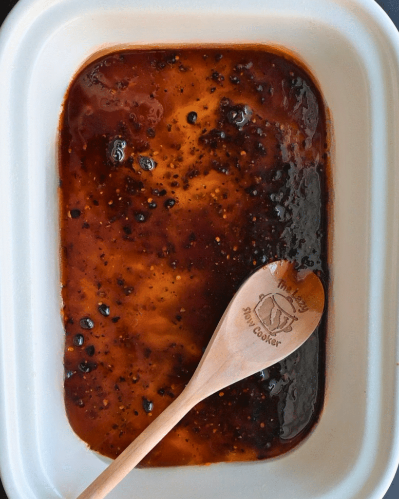 spicy maple sauce in slow cooker before cooking