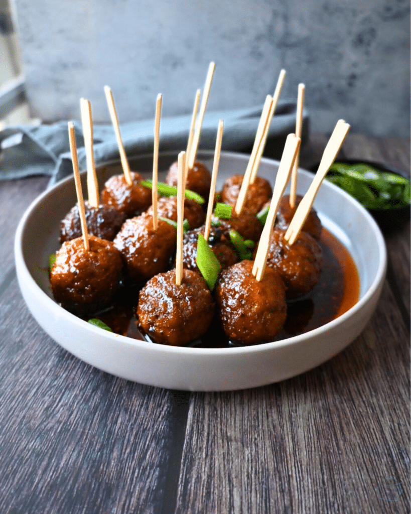 spicy maple meatballs on wooden party picks