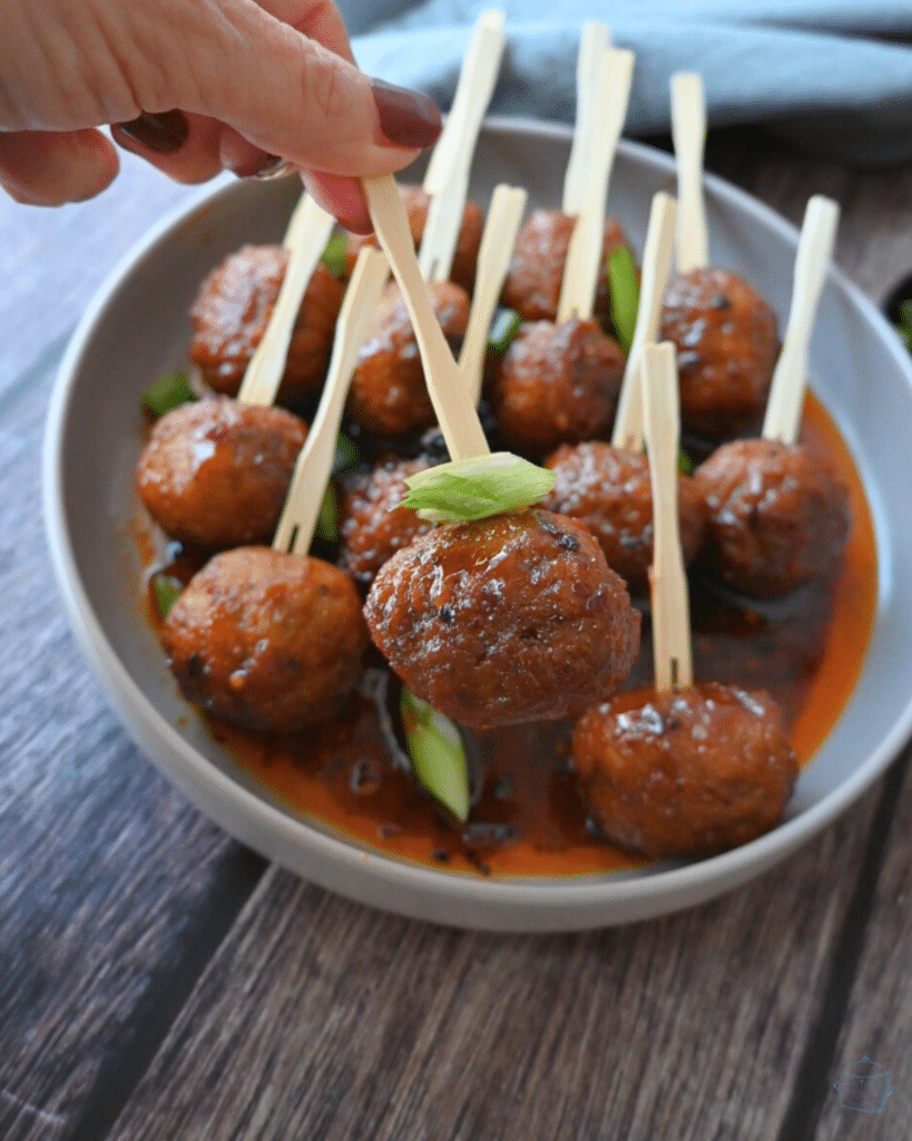 spicy maple meatballs on wooden party picks