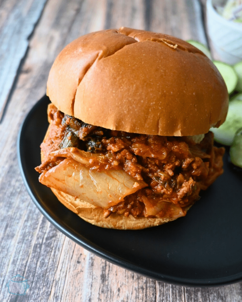 a close of a slow cooker sloppy kimchi Joe sandwich