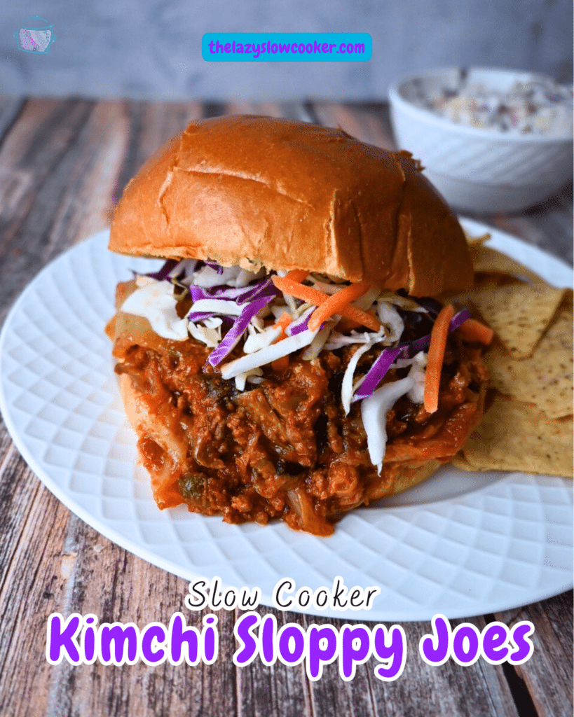 slow cooker kimchi sloppy joe on a brioche roll with a side of chips