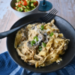finished creamy mushroom chicken and pasta in a crock pot