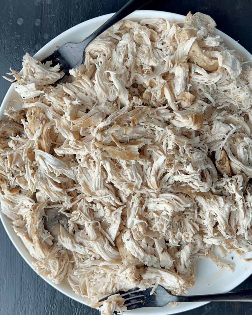 shredded chicken on a white plate