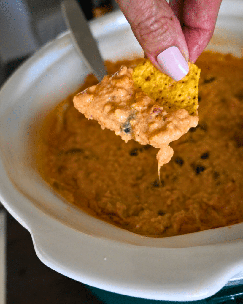 Ground chicken cheesy nacho topping on a chip