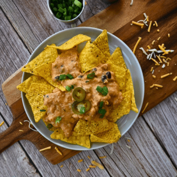 nacho chips topped with slow cooker ground chicken cheesy nacho sauce
