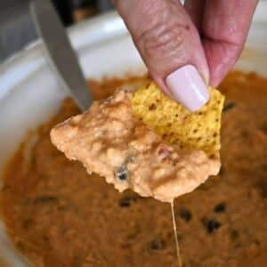 Ground chicken cheesy nacho topping on a chip