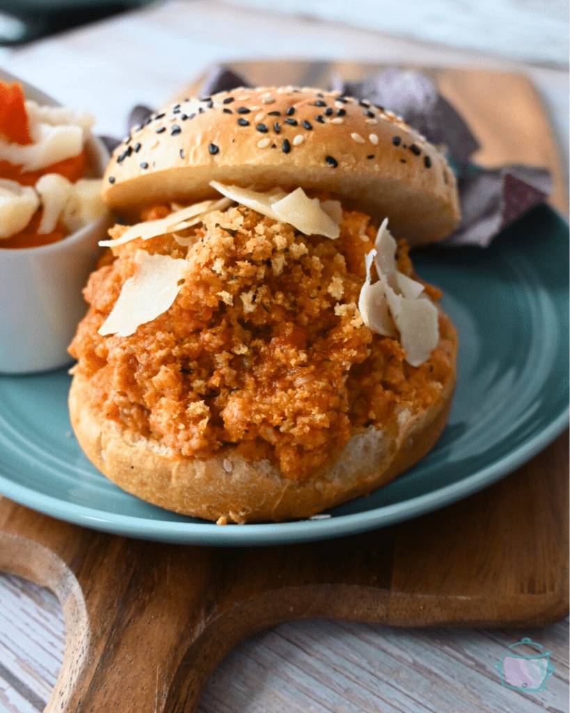 seeded bun filled with slow cooker ground chicken sloppy joes