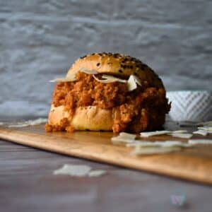 seeded bun filled with slow cooker ground chicken sloppy joes