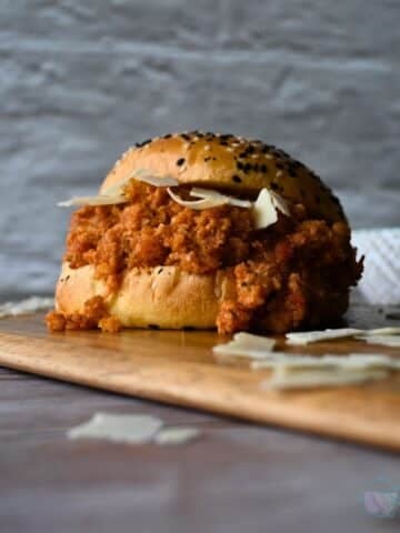 seeded bun filled with slow cooker ground chicken sloppy joes